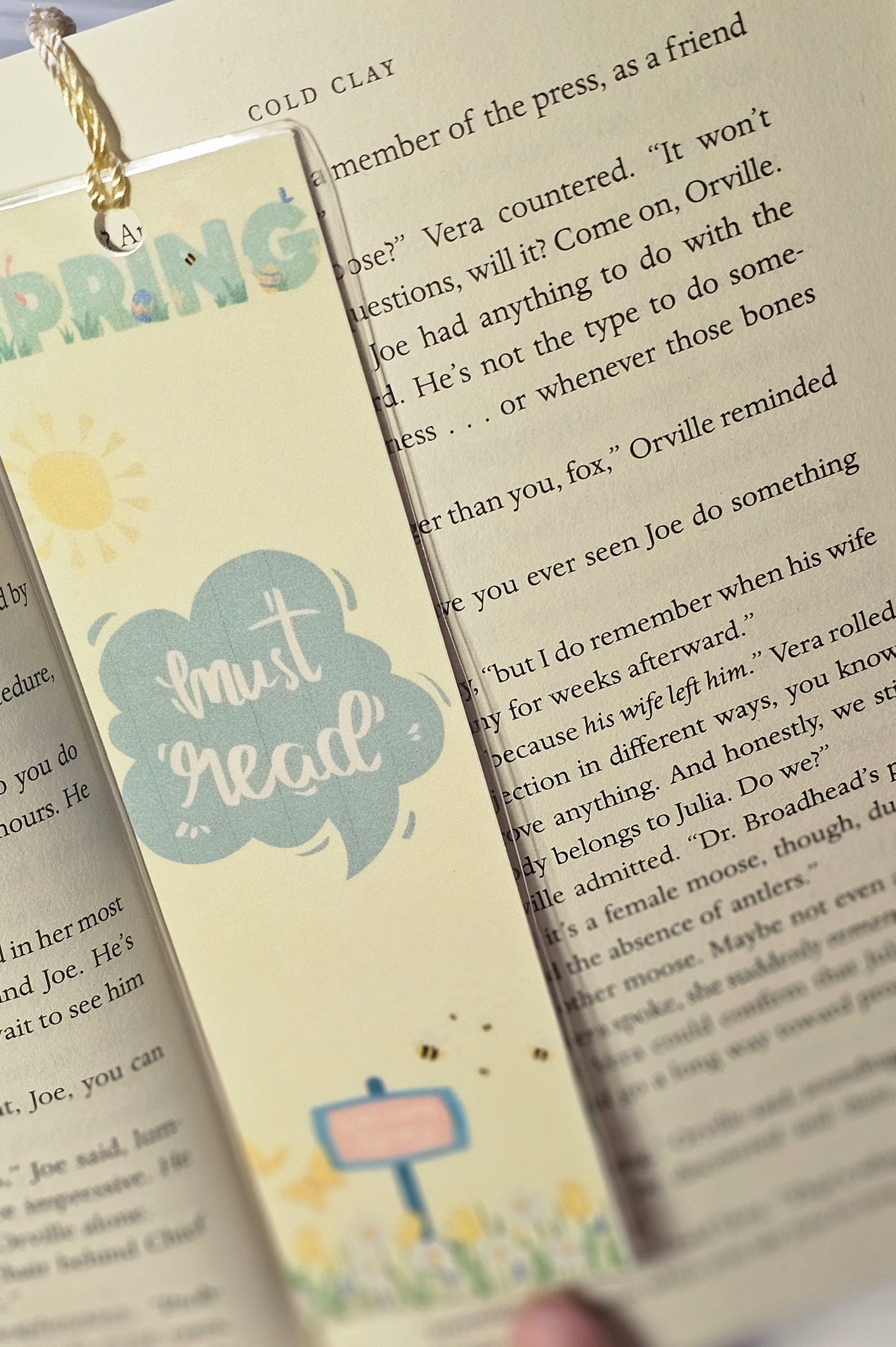 Laminated bookmark - spring must read